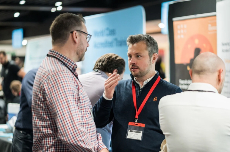 Dominic Howkins at the SHE Show talking to a customer
